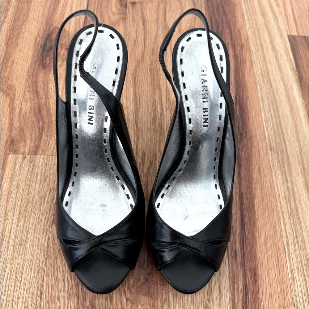 Black peep toe sling back heels. Elastic on back strap.